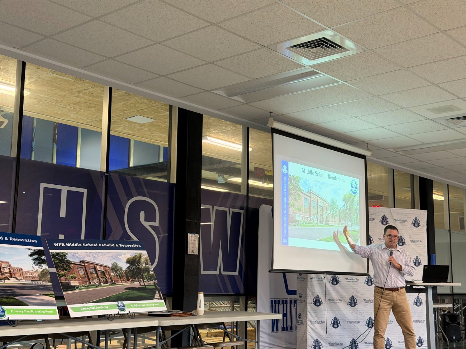 A presenter discusses a conceptual Whitefish Bay Middle School rendering during the September 28 information session