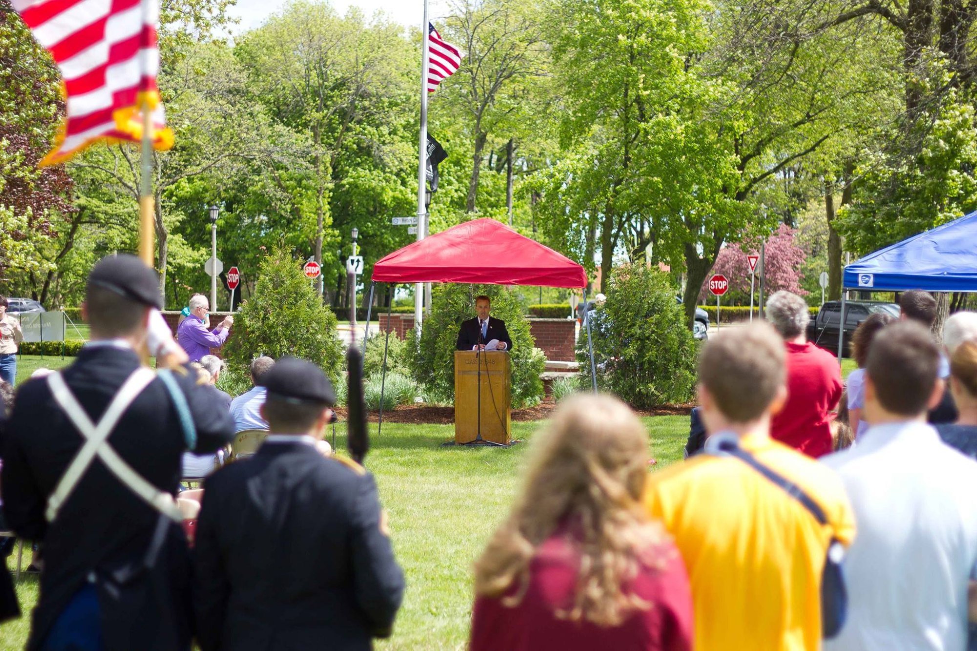 Memorial Day ceremony speaker at Armory Park with veterans and community